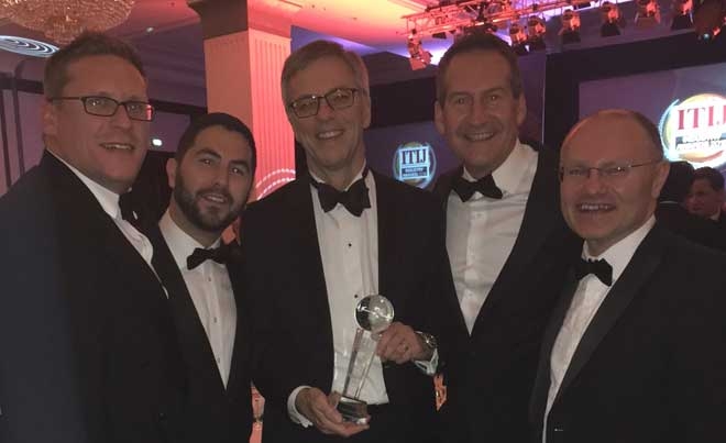 Paul Bevan, Co-Founder of Healix International receives the ITIJ Award for Assistance Company of the Year with Rob Upton, Michael Setford, Gary Gofton and Andy Baker.