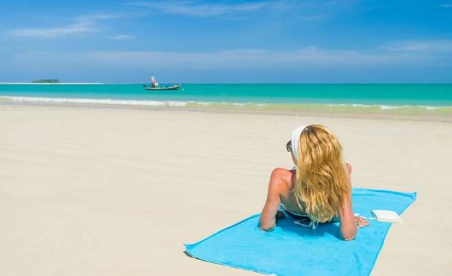 IN THE PICTURE: A high net worth individual expatriate spends Monday morning on the beach.